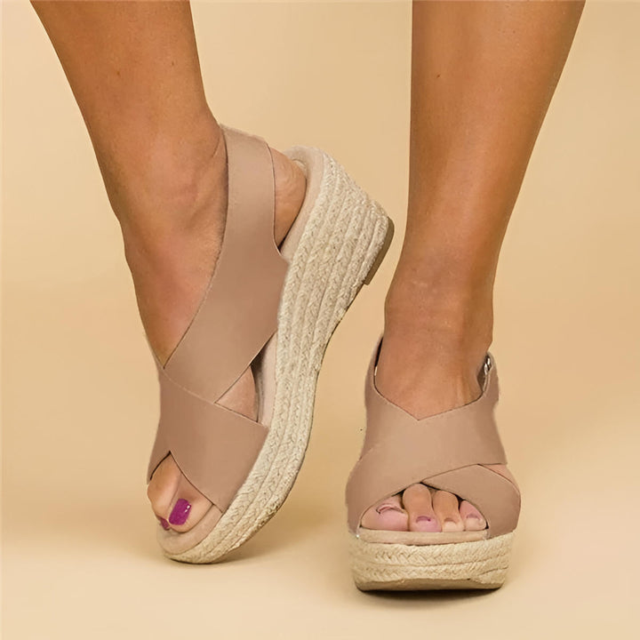 Women's Aeris nude wedge platform sandals with crossover straps and espadrille sole.
