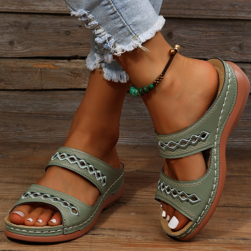 Alice women's sage green double strap slide sandals with decorative cutout detailing and a comfortable sole.