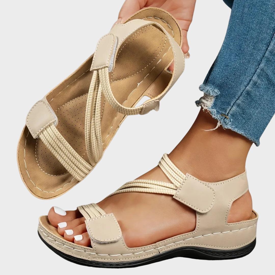 Amalyn women's beige adjustable strap flat sandals with contrast stitching, perfect for warm-weather outfits.