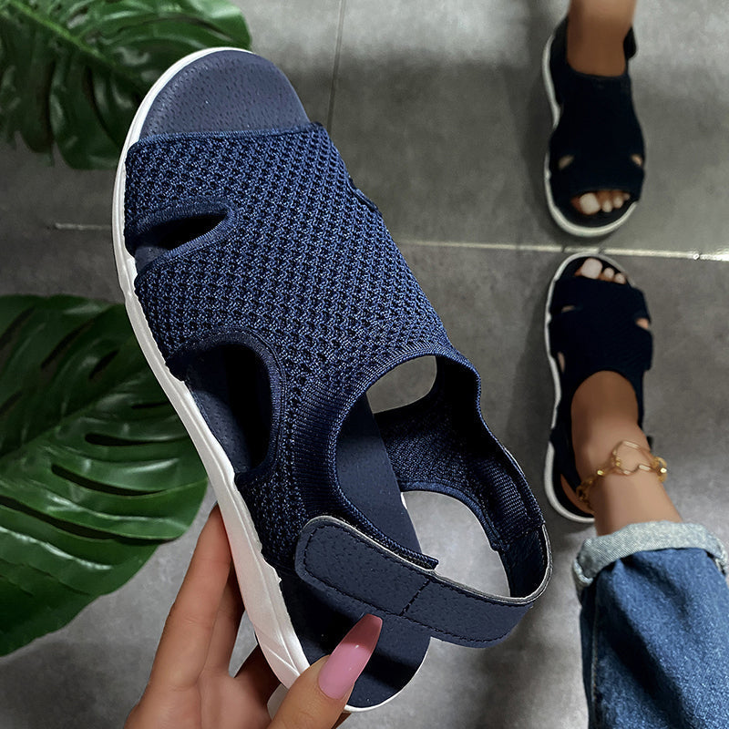 Amiel women's navy open-toe slingback sport sandals with a soft knit-style upper and white sporty flat sole.