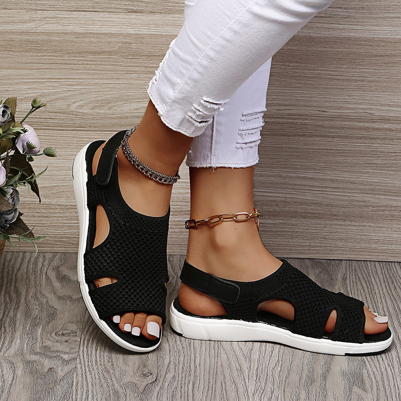 Amiel black open-toe slingback sport sandals with a soft knit-style upper and white sporty flat sole.