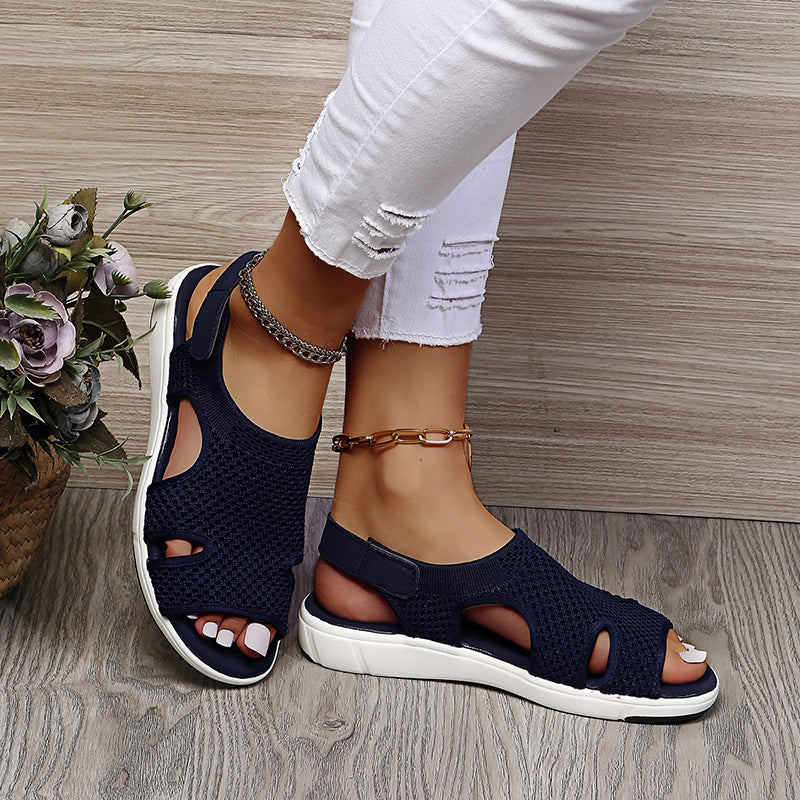 Women's Amiel navy open-toe slingback sport sandals with knit-style upper and white sporty flat sole.