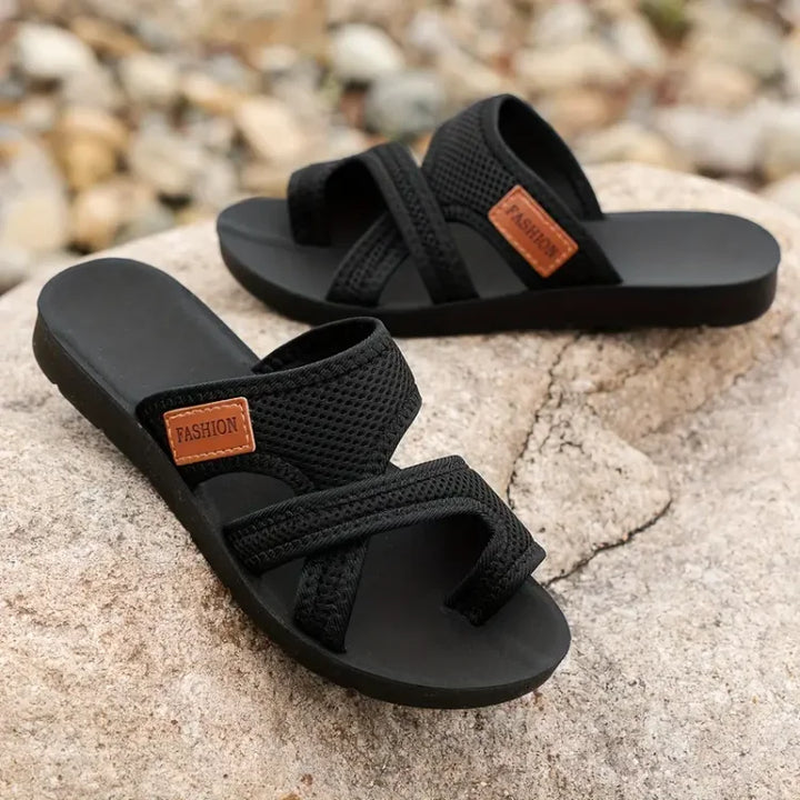 Black Kathleen women's mesh slide sandals with wide straps and a "FASHION" tag.