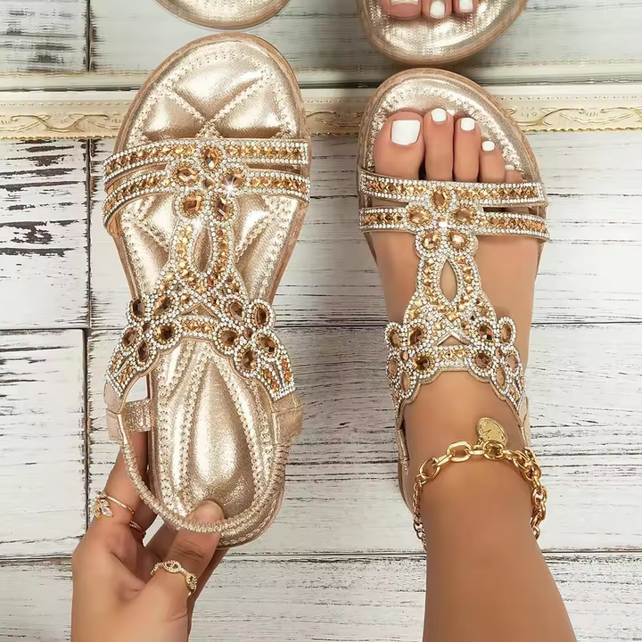Marcella women's gold metallic T-strap sandals with sparkling beaded embellishments and a low sole.