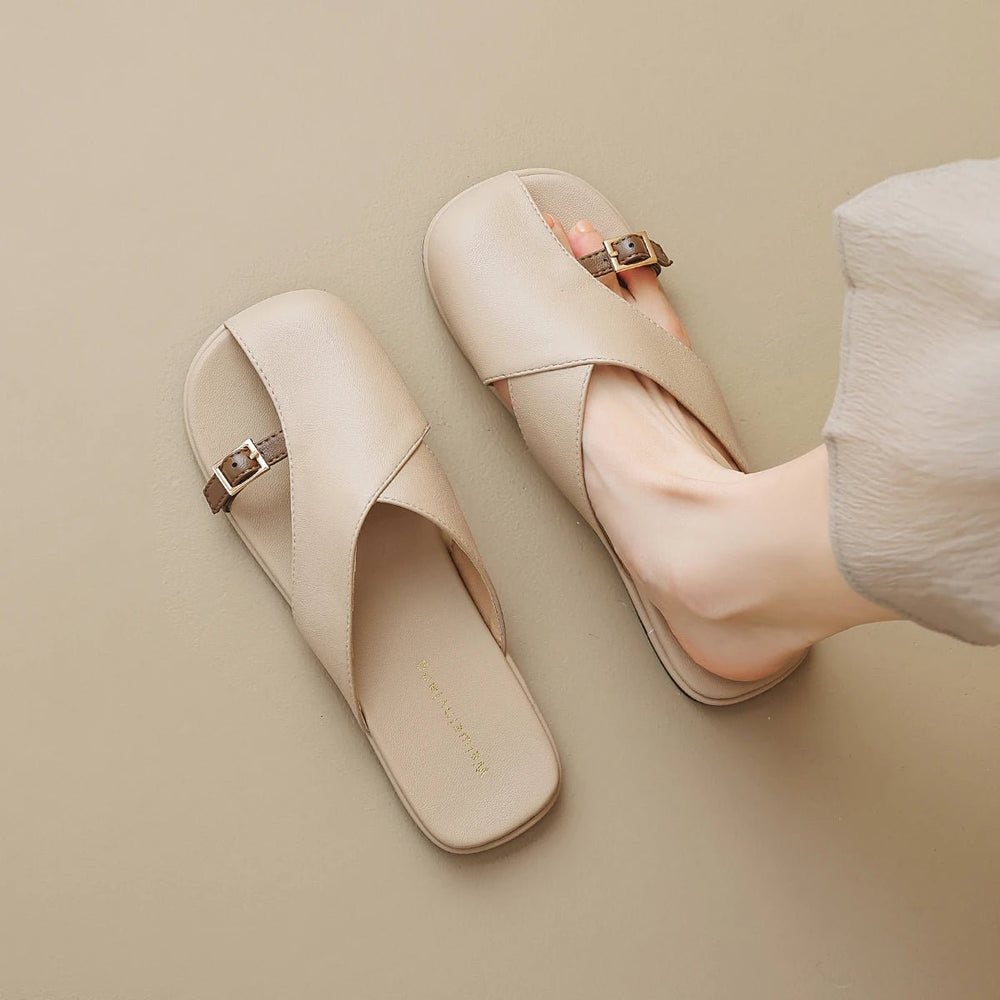 Marzella women's beige cross strap slide sandals with slim buckle detail, offering clean, polished everyday style.