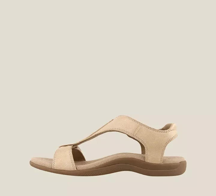 Maureen women's open-toe back strap sandals in a light beige, featuring adjustable straps and a flat sole.