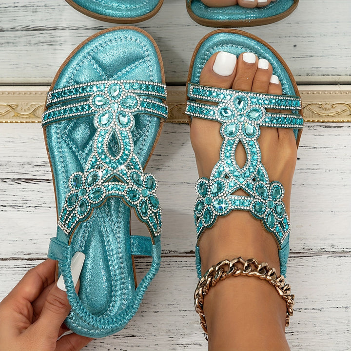 Sapphira women's turquoise beaded flat sandals with ornate crystal embellishments and an open toe design.