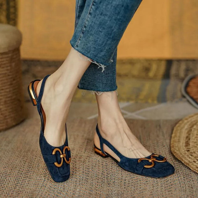 Verena women's navy slingback buckle flats with a closed toe, low flat heel, and gold-tone buckle detail.