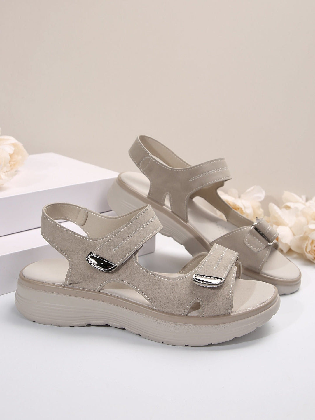 Xaviera women's adjustable platform sandals in a neutral tone with contrast stitching and polished strap finish.