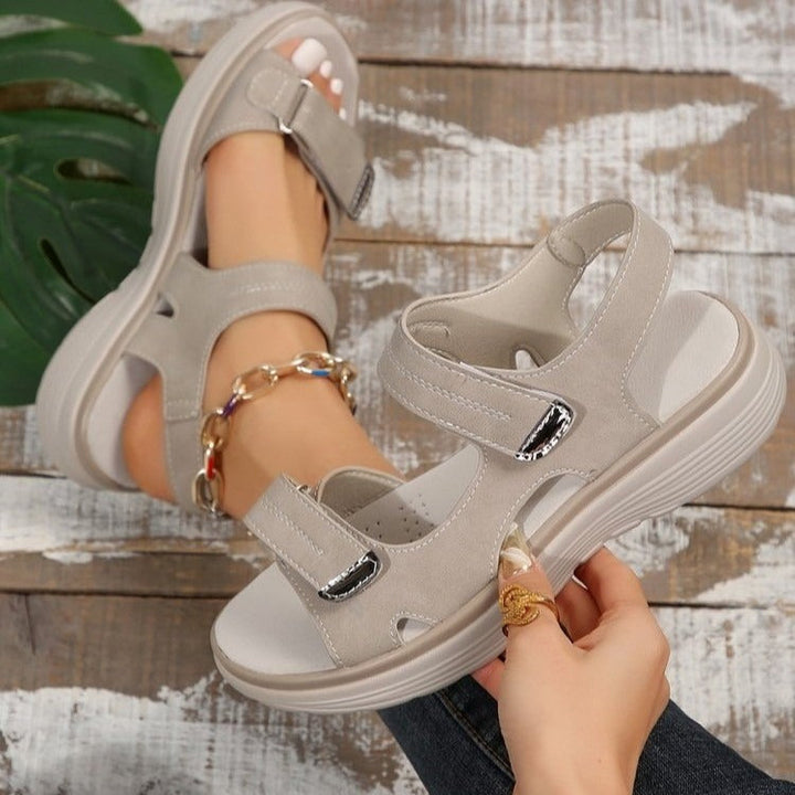 Xaviera women's adjustable platform sandals in light grey, featuring open toe, adjustable strap styling, and contrast stitching.