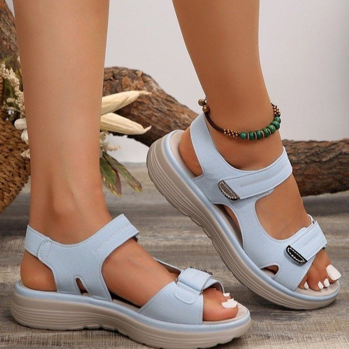 Women's light blue adjustable platform sandals with contrast stitching and open toe for warm-weather comfort.