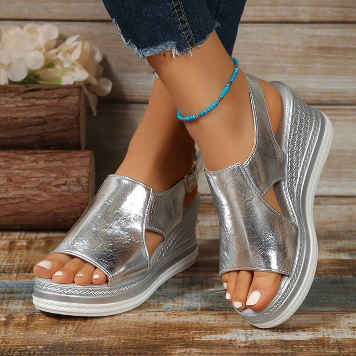 Women's Zafira metallic silver platform wedge sandals with open toe and slingback strap.