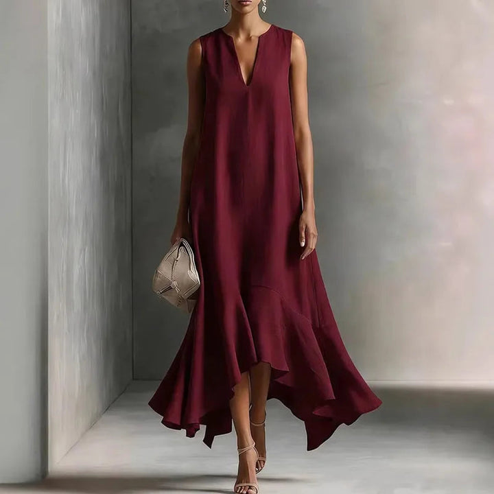 Adeline women's flowy maxi dress in deep burgundy with a V-neckline and ruffle hem.