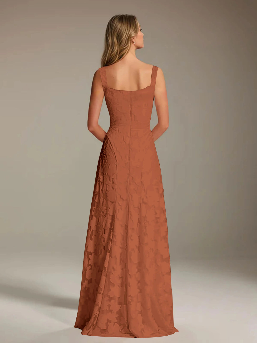 Adrienne women's rust floral lace A-line bridesmaid gown with square neckline, seen from the back.