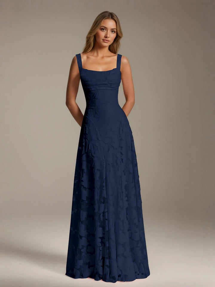 Adrienne navy floral lace A-line bridesmaid gown with square neckline and floor-length skirt.