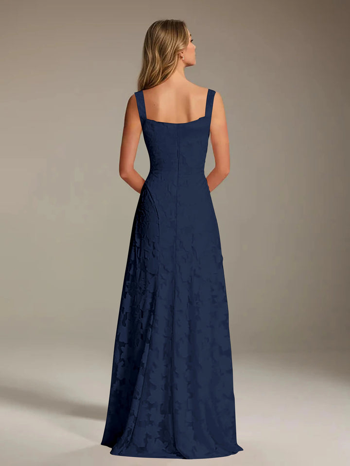 Adrienne navy floral lace A-line bridesmaid gown with square neckline, viewed from the back.