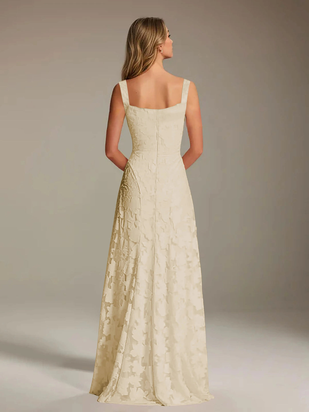 Adrienne women's floral lace A-line bridesmaid gown in light beige, shown from the back.