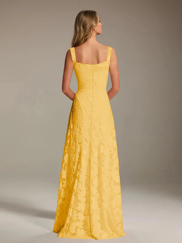 Adrienne yellow floral lace A-line bridesmaid gown with square neckline, seen from the back.
