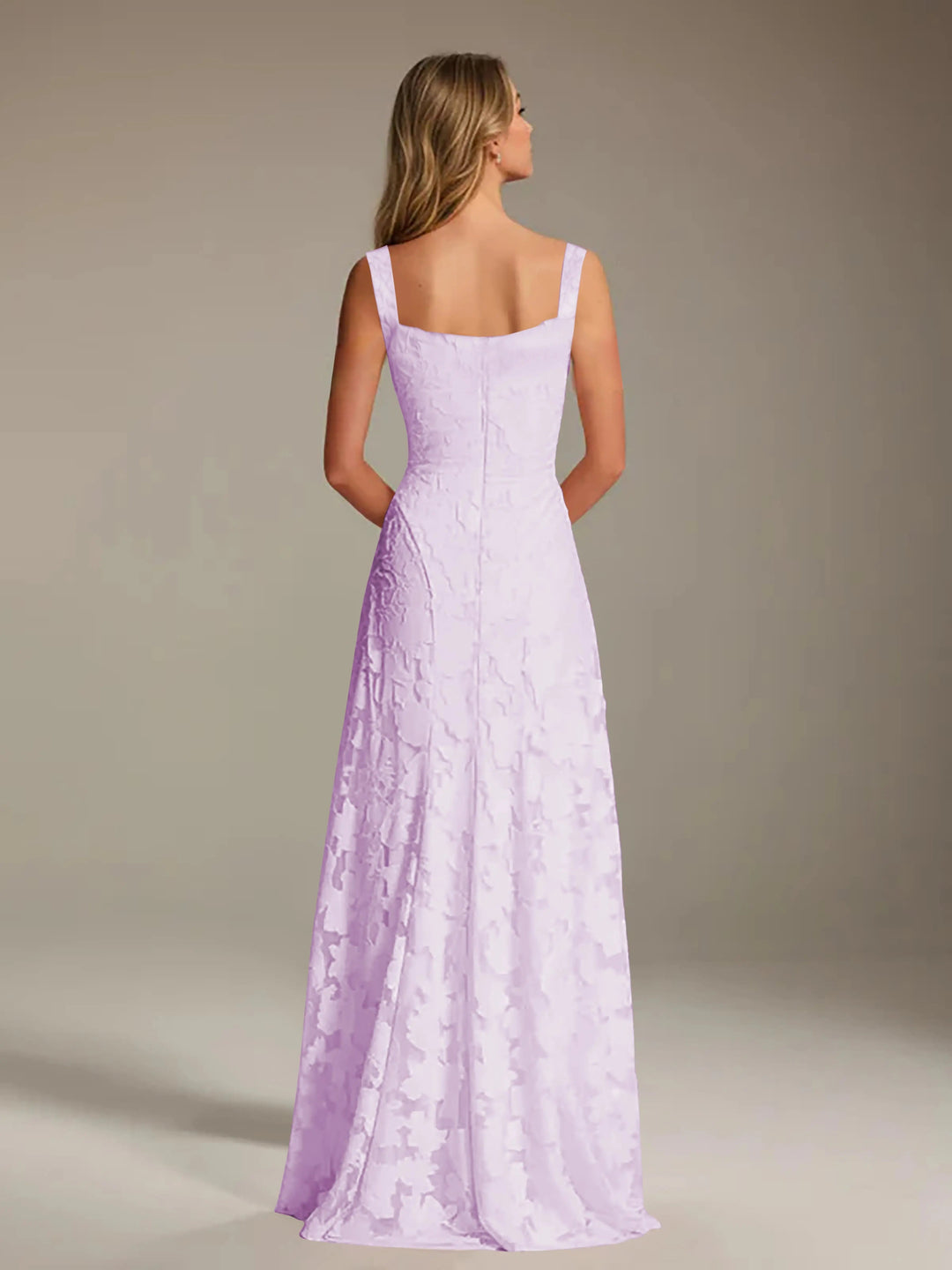 Back view of Adrienne A-line floral lace bridesmaid dress in lilac with square neckline.