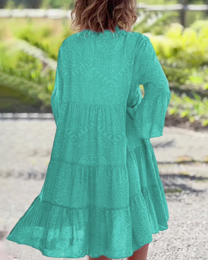Agnes women's tiered boho V-neck dress in bright teal with subtle embroidered patterns and flowy silhouette.