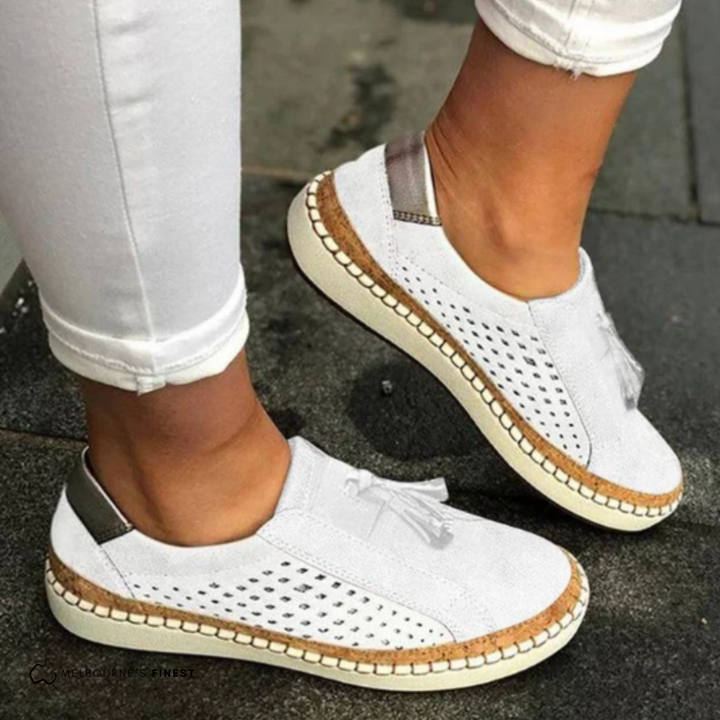 White Amari women's orthopedic slip-on shoes with arch support, featuring a breathable knit upper.
