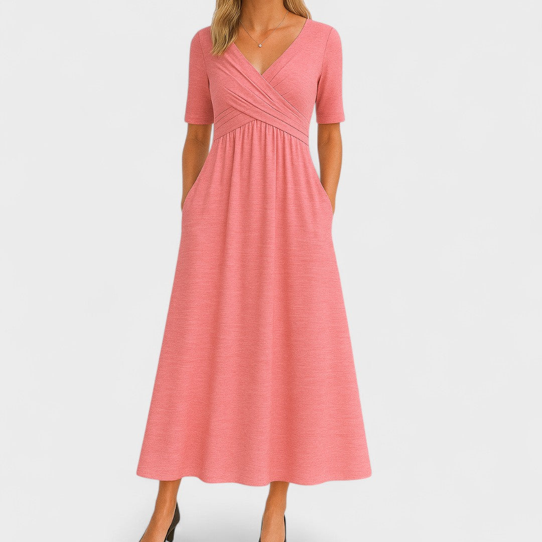 Amaya women's V-neck summer midi dress in coral pink with wrap bodice, elbow sleeves, and side pockets.