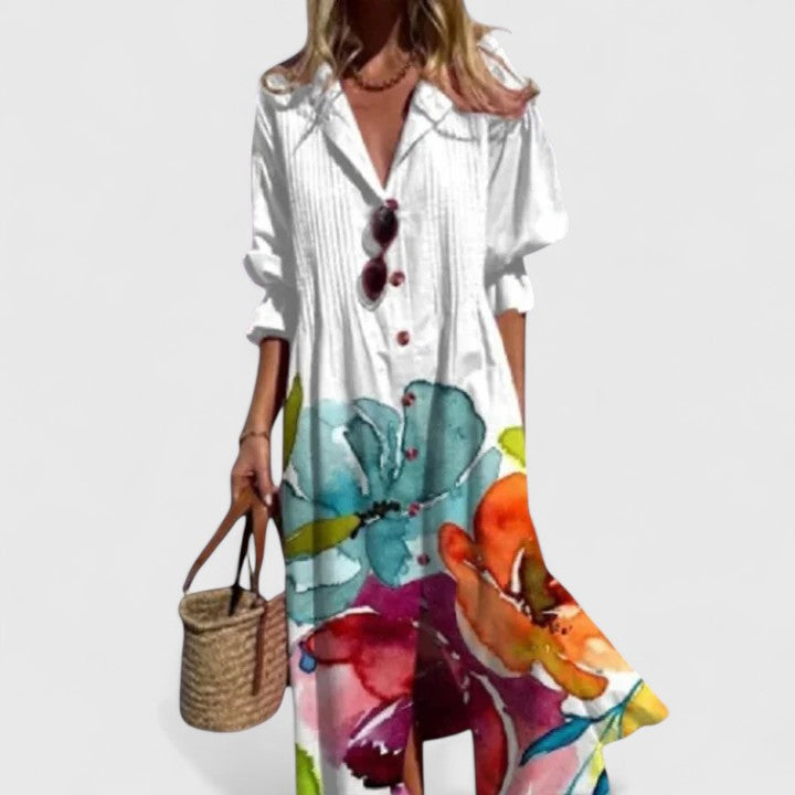 Aria women's boho maxi dress: white, flowing, with vibrant watercolor floral prints and long sleeves.