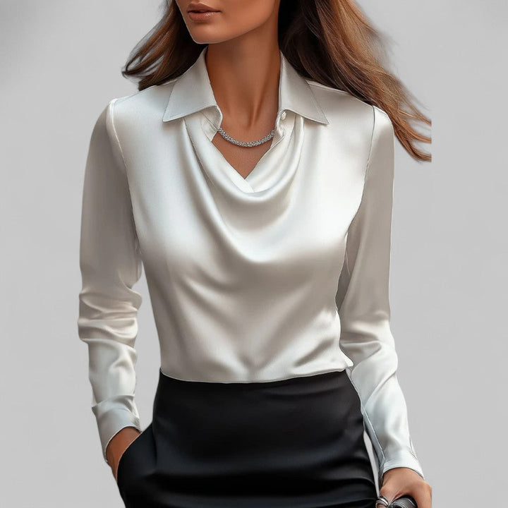 Woman wearing the Aria white long-sleeve satin blouse with a draped cowl neckline and collar.