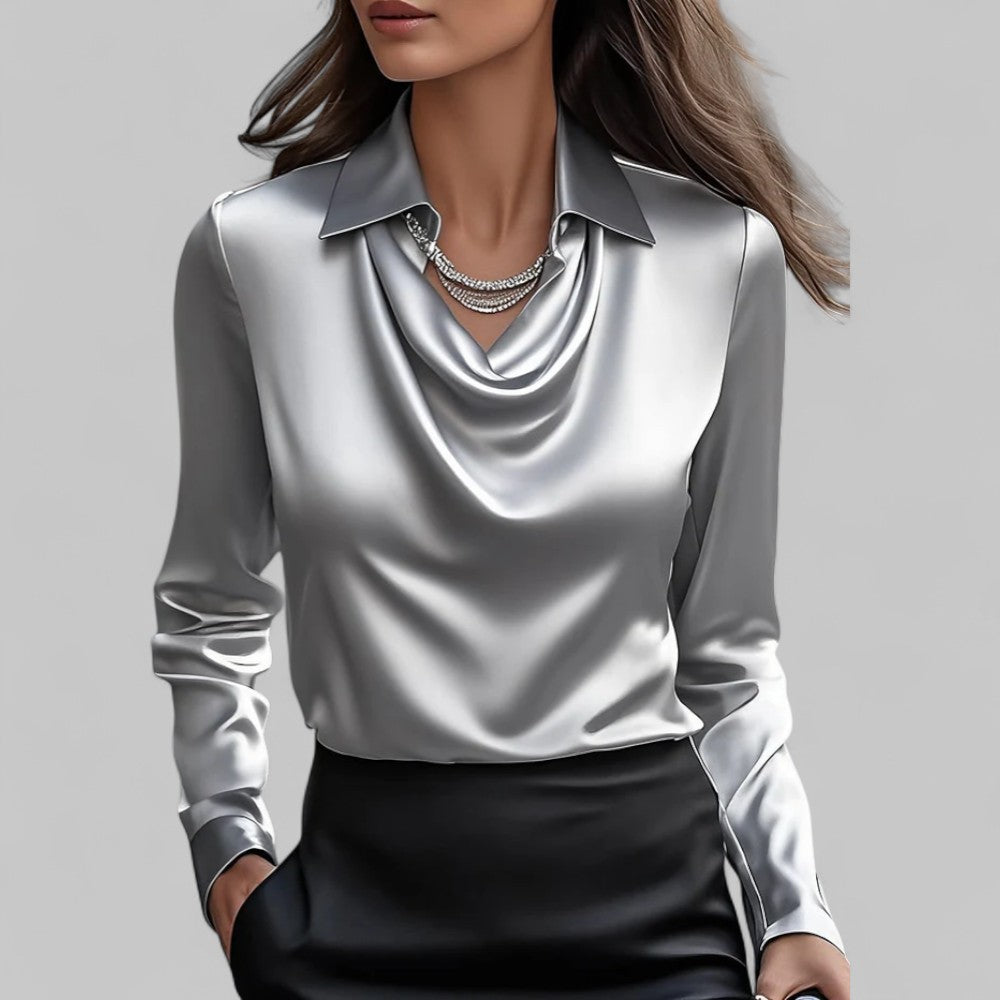 Woman wearing the Aria silver satin long-sleeve blouse with a draped cowl neckline and collar.