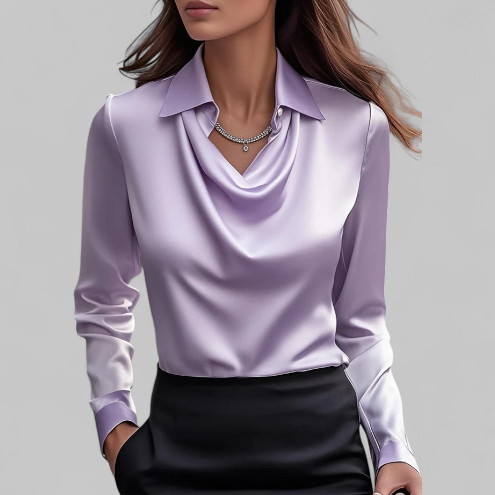 Woman wearing the Aria lavender satin blouse with a draped cowl neckline and collar.