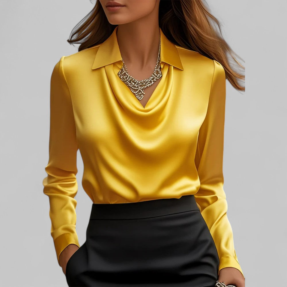 Woman wearing the Aria yellow satin blouse with a draped cowl neckline and collar.