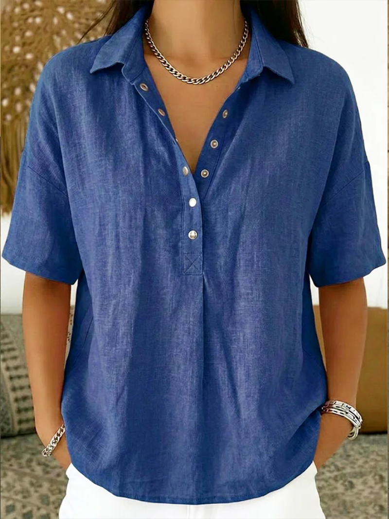 Ava women's collared button-up shirt in breathable blue fabric, featuring a relaxed fit and adjustable neckline.