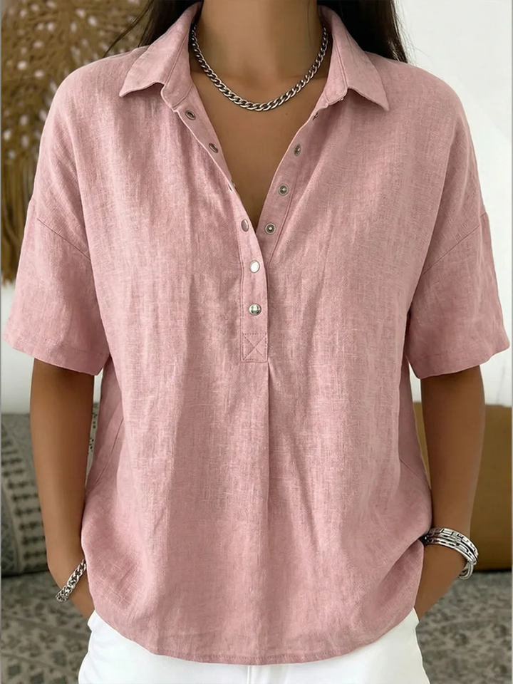 Ava women's collared button-up shirt in soft pink, featuring a relaxed fit and adjustable neckline.