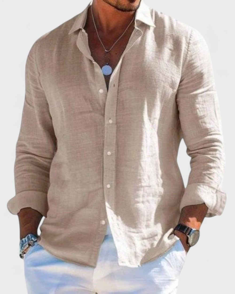 Men's Blake natural linen button-up shirt, straight cut, classic collar, with white pants.