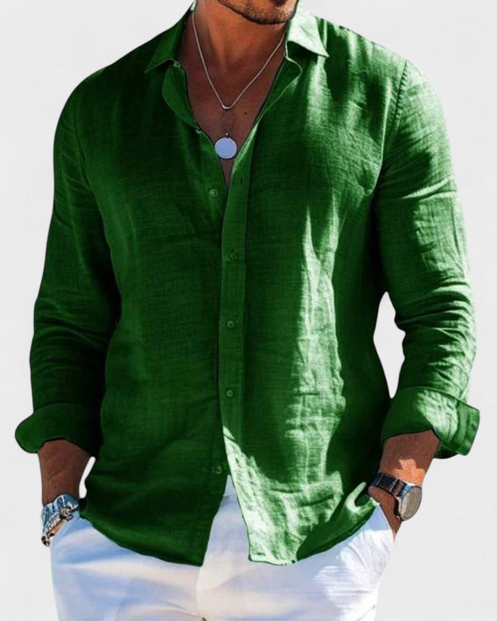 Men's Blake green linen button-up shirt with classic collar, paired with white pants and silver necklace.
