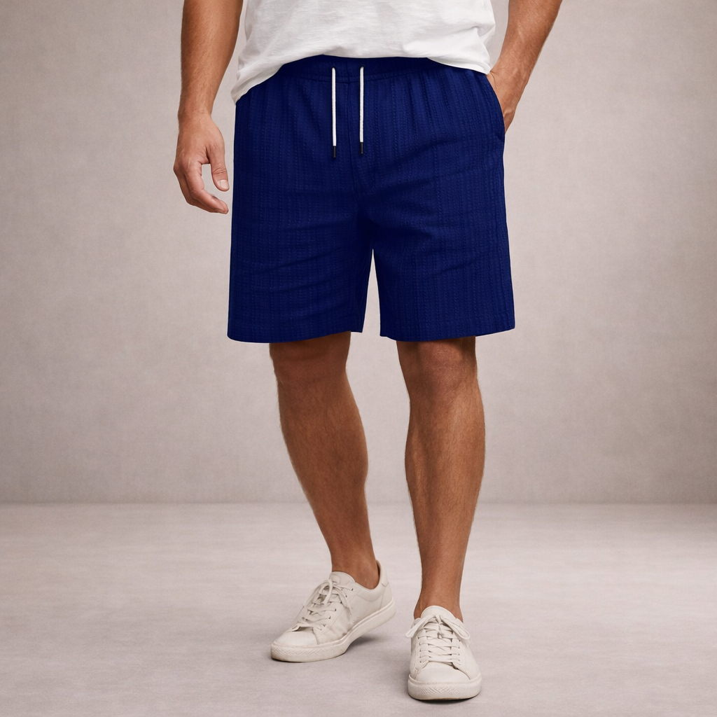 Men's navy blue linen drawstring shorts with textured fabric, above-knee length, and side pockets.