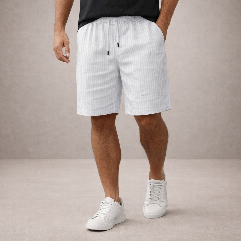 Men's white linen drawstring shorts with subtle vertical stripes, side pockets, and above-knee length.