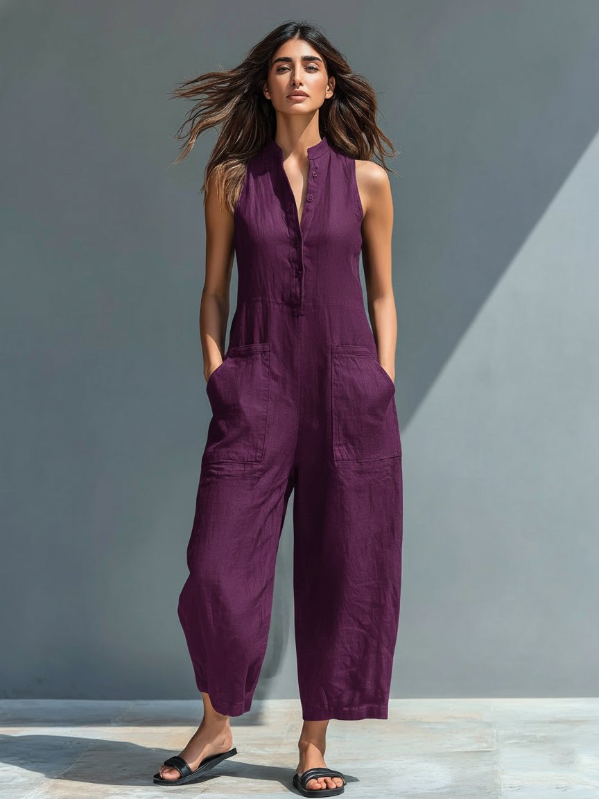 Women's Cassia linen blend sleeveless purple jumpsuit with stand collar, button-front, wide-leg, and front pockets.
