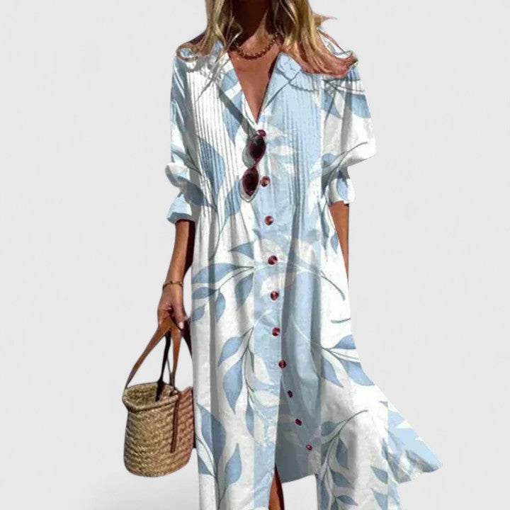 Plus size women's boho summer dress: white and blue leaf print, button-front, long sleeves, flowing silhouette.