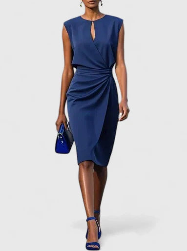 Navy blue sleeveless keyhole sheath dress with draped waist, made from a smooth, flowing fabric.