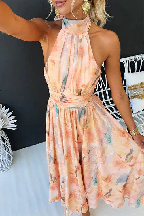 Women's Cha floral halter maxi dress in peach with a flowing skirt and defined waist.