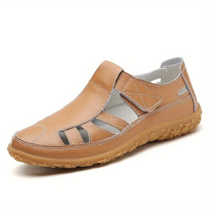 Clara tan leather closed-toe fisherman sandals with breathable cutouts and a textured flat sole.