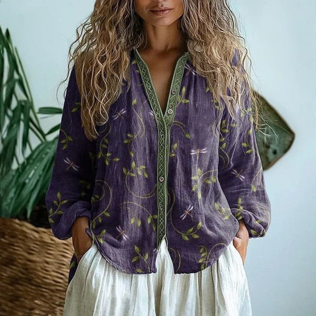 Purple linen button-down blouse with green vine and dragonfly print, featuring contrast trim along the placket.