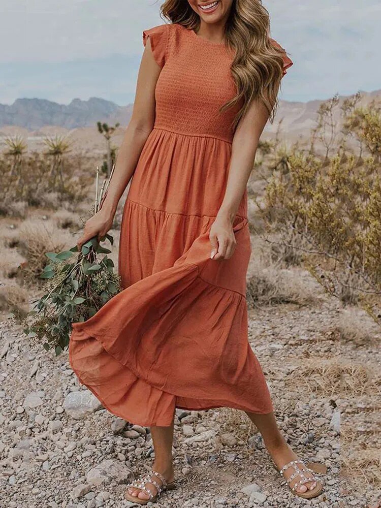 Clara Women's Tiered Cap Sleeve Midi Dress in a flowing rust orange, featuring a fitted bodice and A-line skirt.