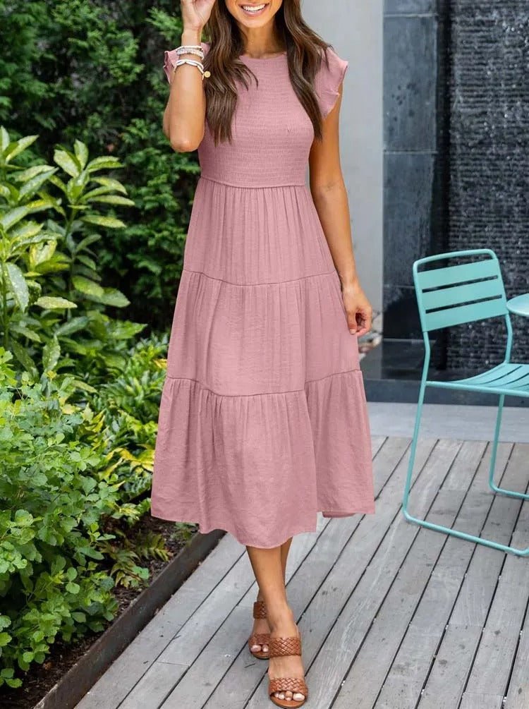 Clara Women's Tiered Cap Sleeve Midi Dress in pink, featuring a fitted bodice and flowing tiered skirt.