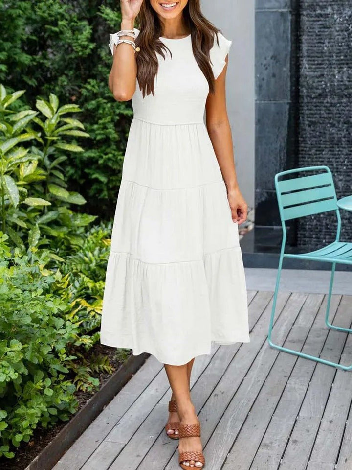 Clara women's white tiered cap sleeve midi dress with a fitted bodice and flowing skirt, perfect for any occasion.
