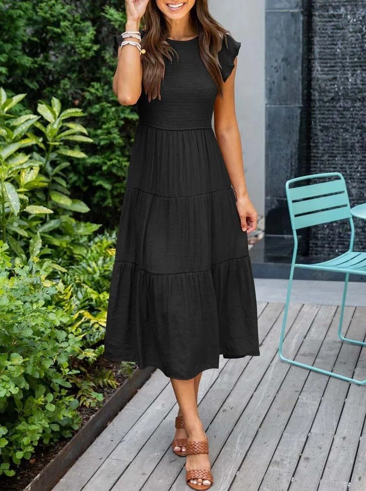 Clara women's black tiered cap sleeve midi dress with a fitted bodice and flowing skirt.