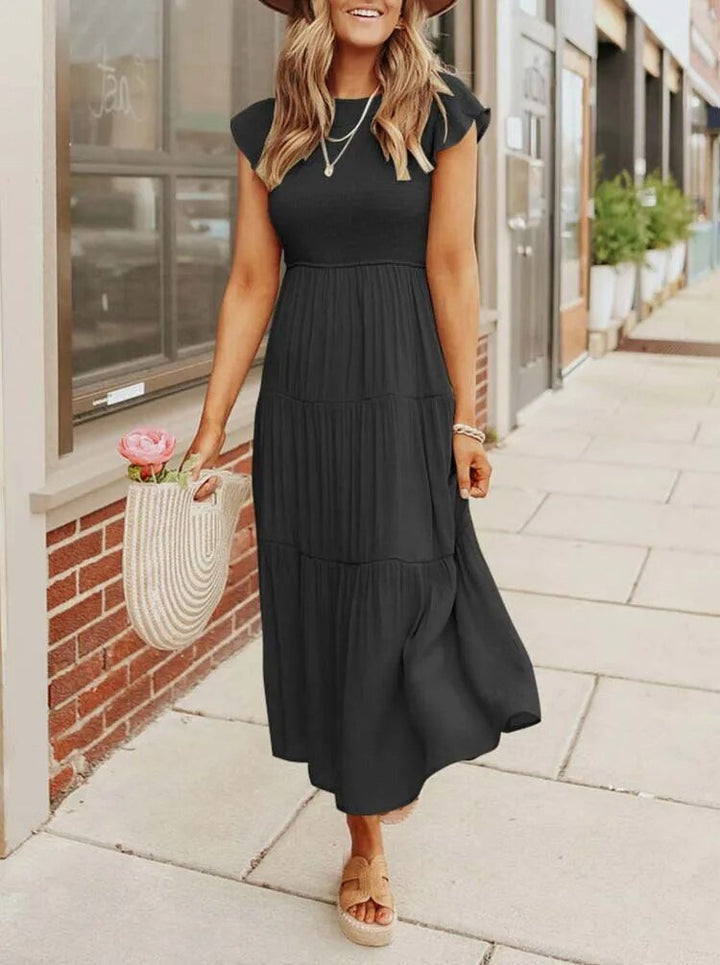 Clara women's black tiered cap sleeve midi dress with a fitted bodice and flowing skirt, perfect for day to evening.