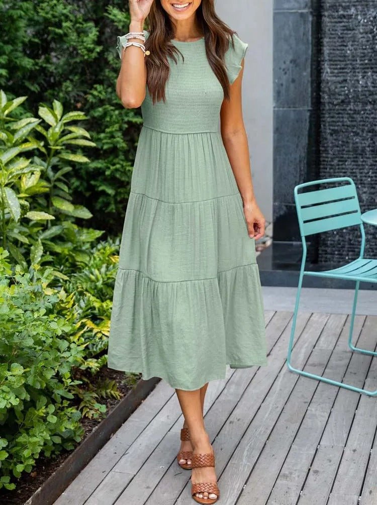 Clara Women's Tiered Cap Sleeve Midi Dress in sage green, featuring a fitted shirred bodice and flowing A-line skirt.