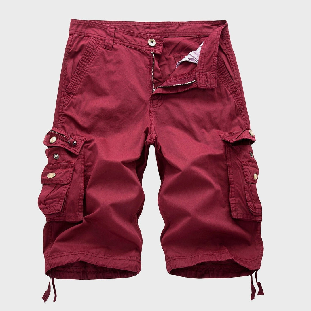 Men's Cole knee-length red cargo shorts with multi-pocket design, zip fly, and adjustable drawstring hems.